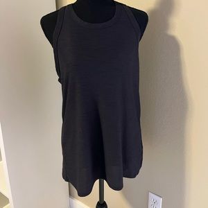 One charcoal and one green tall workout tank